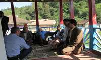 دیدارمدیریت وکارکنان شبکه بهداشت درمان فومن با پدر شهید ایزدپناه